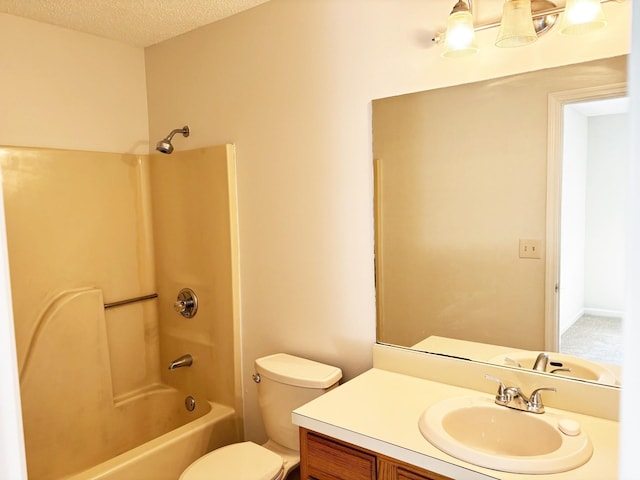 full bathroom with shower / tub combination, vanity, a textured ceiling, and toilet