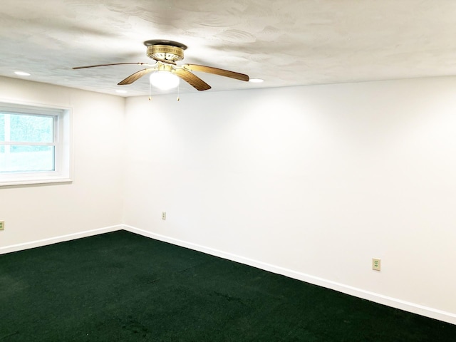 unfurnished room with carpet flooring and ceiling fan