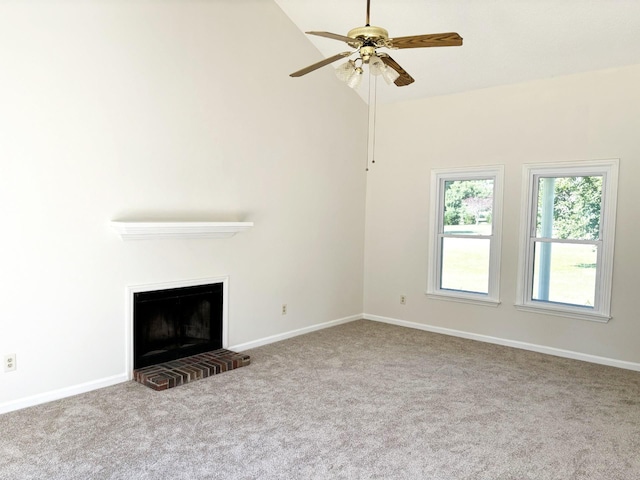 unfurnished living room featuring ceiling fan, vaulted ceiling, light carpet, and a brick fireplace