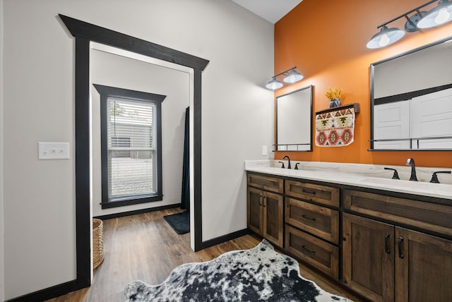 bathroom with hardwood / wood-style floors and vanity