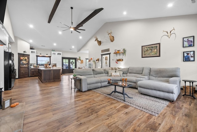 living room featuring ceiling fan, french doors, high vaulted ceiling, and wood-type flooring