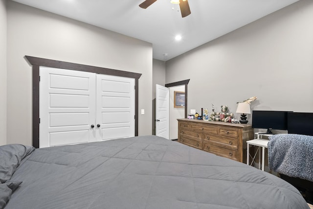 bedroom featuring ceiling fan and a closet