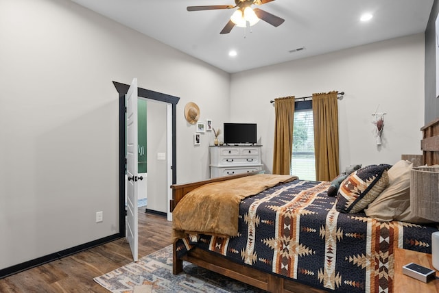 bedroom with ceiling fan and hardwood / wood-style flooring