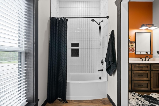 bathroom featuring vanity, wood-type flooring, and shower / tub combo with curtain