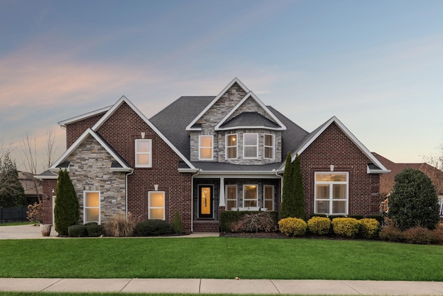 view of front of property with a lawn