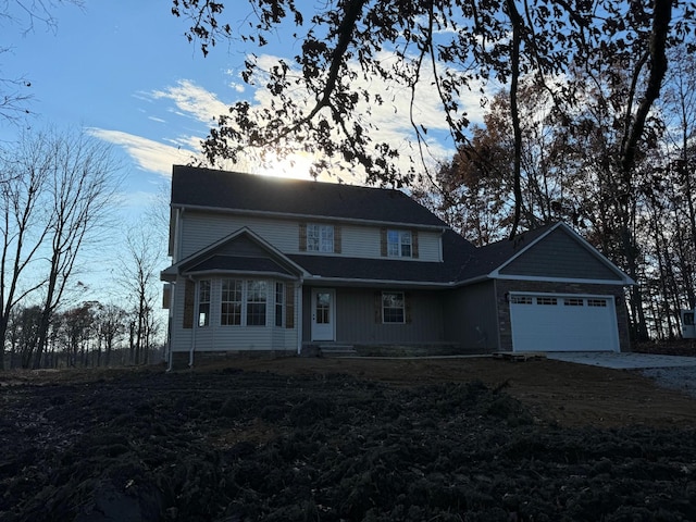 front of property with a garage