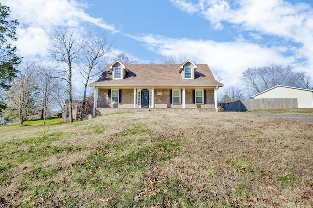 new england style home with covered porch