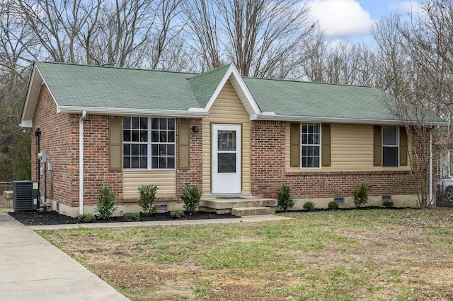 ranch-style house with central AC unit and a front lawn