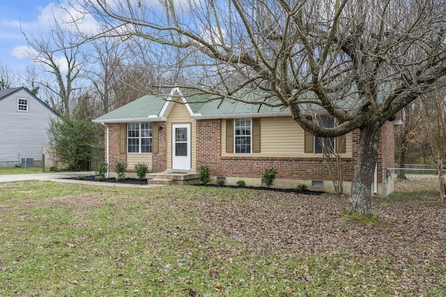 view of front of house with a front yard and central AC unit