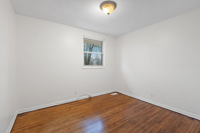 empty room featuring wood-type flooring