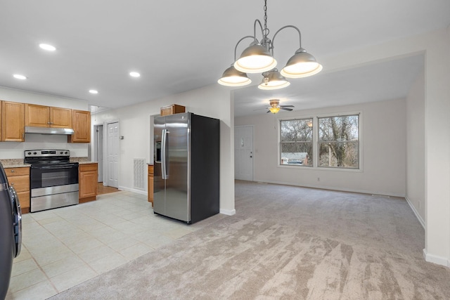 kitchen featuring ceiling fan, light stone counters, decorative light fixtures, light colored carpet, and stainless steel appliances