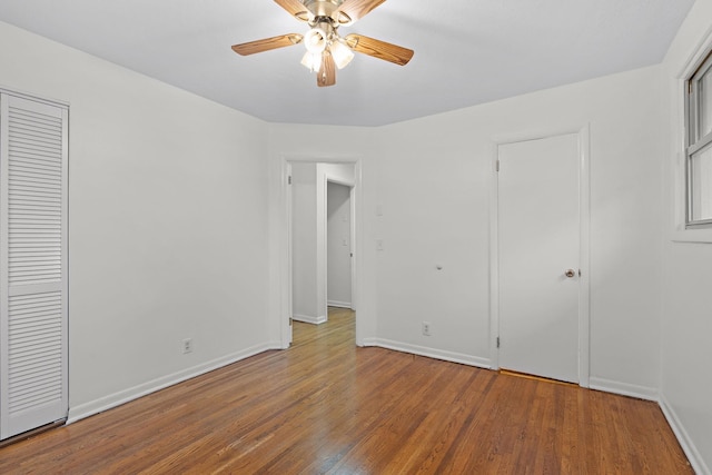 unfurnished bedroom featuring wood-type flooring and ceiling fan