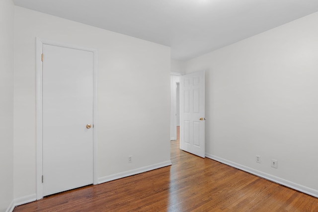 unfurnished bedroom featuring hardwood / wood-style floors