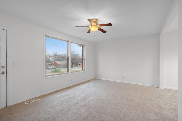 carpeted empty room with ceiling fan