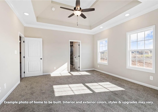 unfurnished bedroom featuring a raised ceiling, ceiling fan, light colored carpet, and ornamental molding