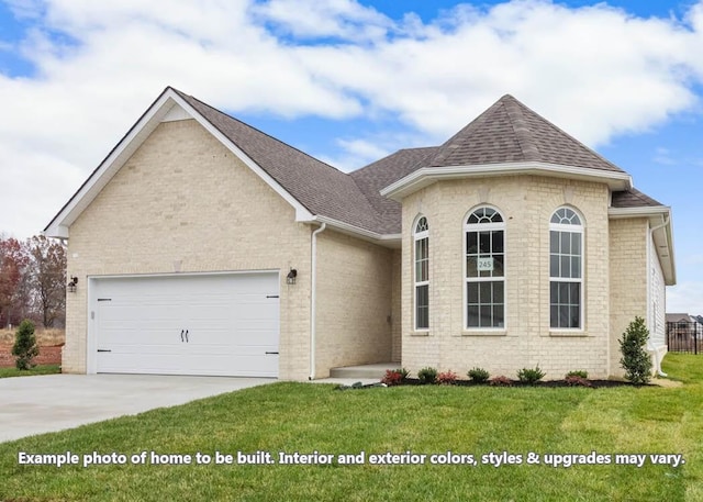 view of front facade with a garage and a front lawn