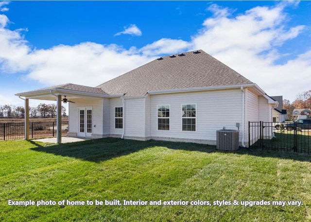 rear view of property with french doors, cooling unit, a lawn, and ceiling fan