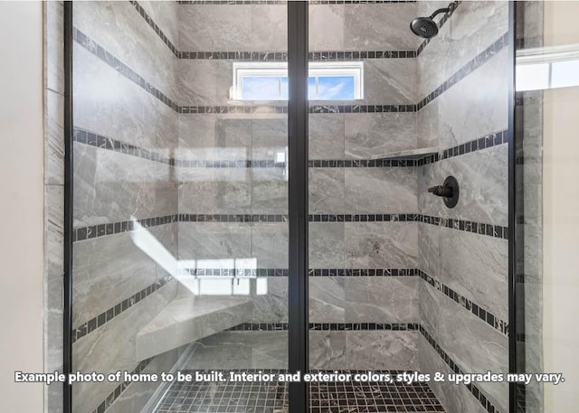 bathroom featuring tiled shower