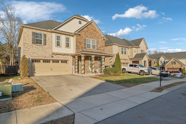 view of front of property with covered porch and a garage