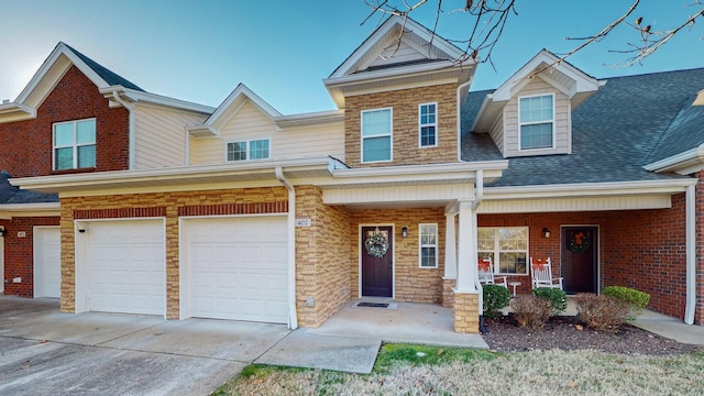 view of front of property with a garage and covered porch