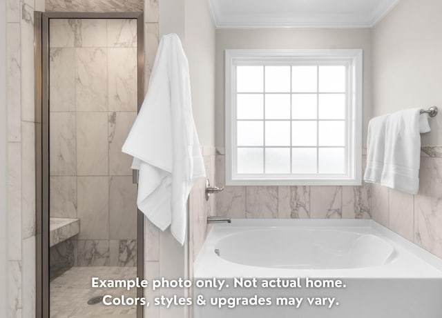 bathroom with ornamental molding and plus walk in shower