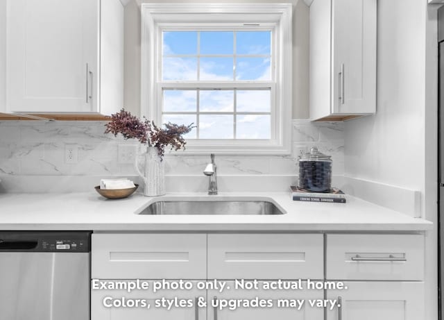 kitchen with white cabinetry, sink, backsplash, and stainless steel dishwasher