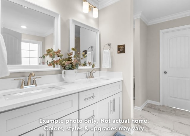 bathroom with crown molding and vanity