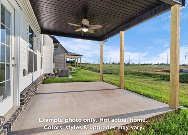 view of patio / terrace featuring a rural view, central AC unit, and ceiling fan