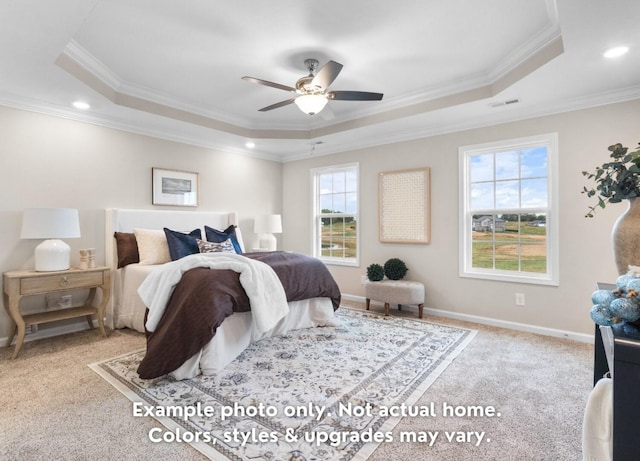 carpeted bedroom with crown molding, ceiling fan, and a tray ceiling