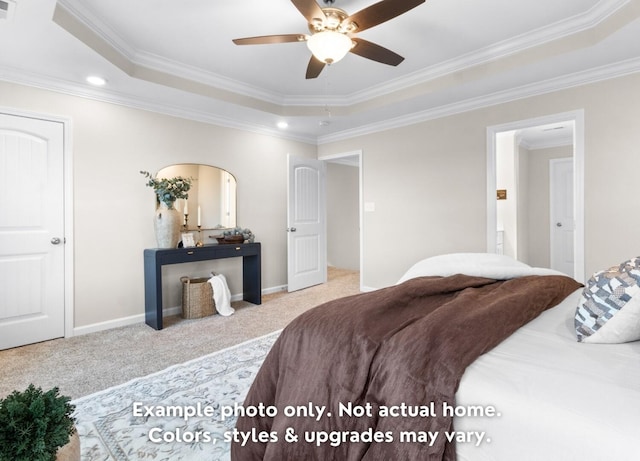 bedroom with crown molding, light colored carpet, a raised ceiling, and ceiling fan