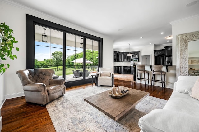 living room with dark hardwood / wood-style flooring and ornamental molding