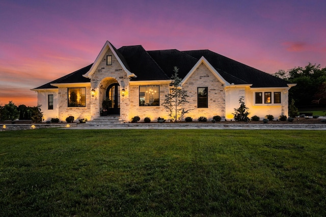 view of front of house with a lawn