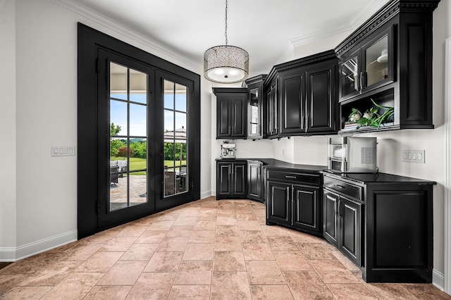 kitchen with crown molding, french doors, and pendant lighting