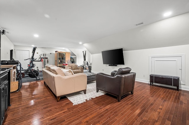 living room with dark hardwood / wood-style flooring and lofted ceiling