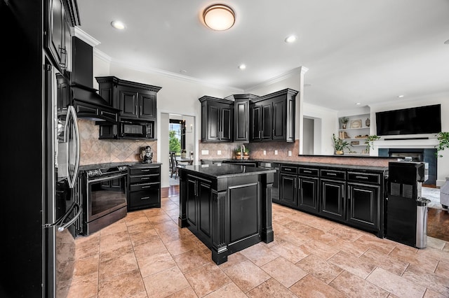 kitchen featuring a center island, backsplash, dark stone countertops, crown molding, and black appliances