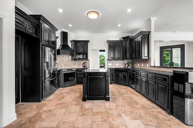 kitchen with a wealth of natural light, a kitchen island, stainless steel appliances, and custom range hood