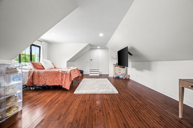 bedroom with dark hardwood / wood-style floors and vaulted ceiling