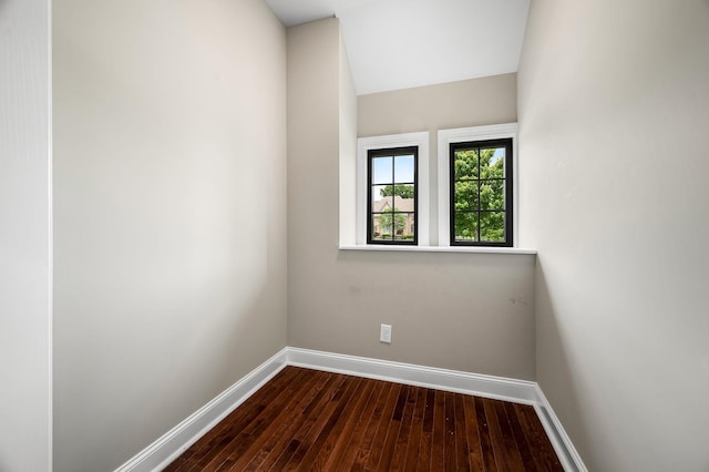 spare room featuring dark hardwood / wood-style flooring