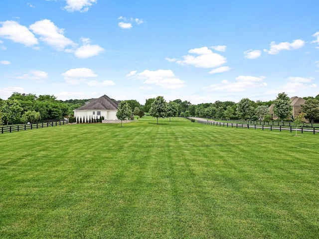 view of yard with a rural view