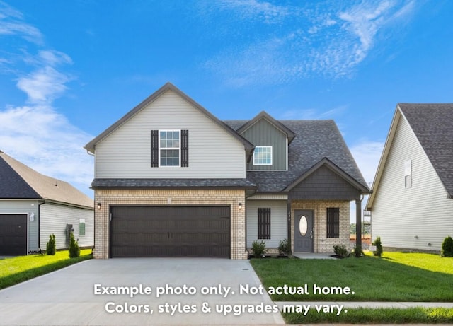 view of front of house featuring a garage and a front lawn