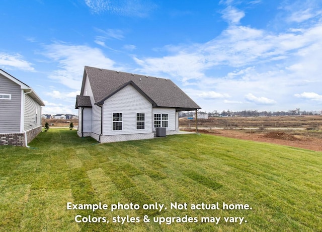 back of property with a yard and central AC