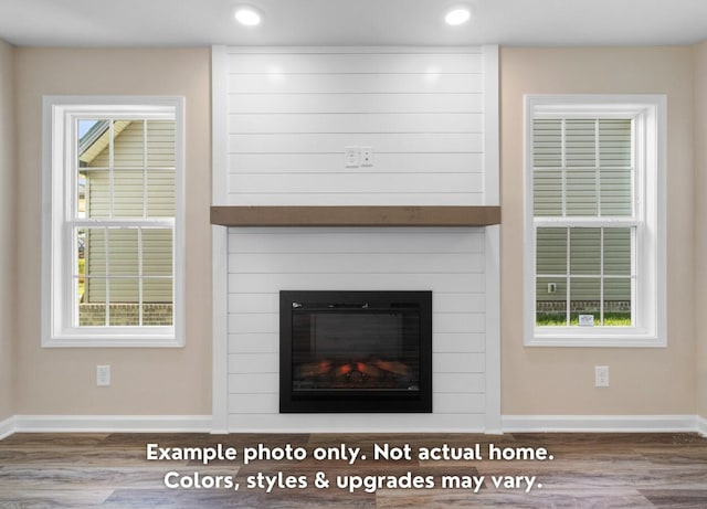 interior details with a fireplace and hardwood / wood-style floors