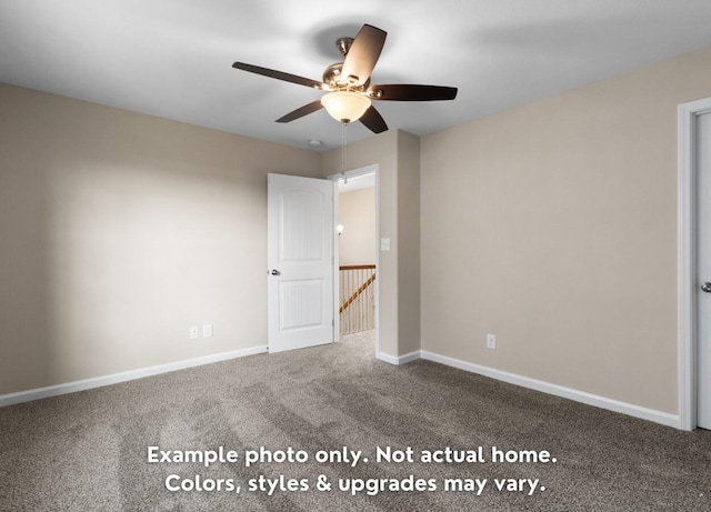 carpeted spare room featuring ceiling fan