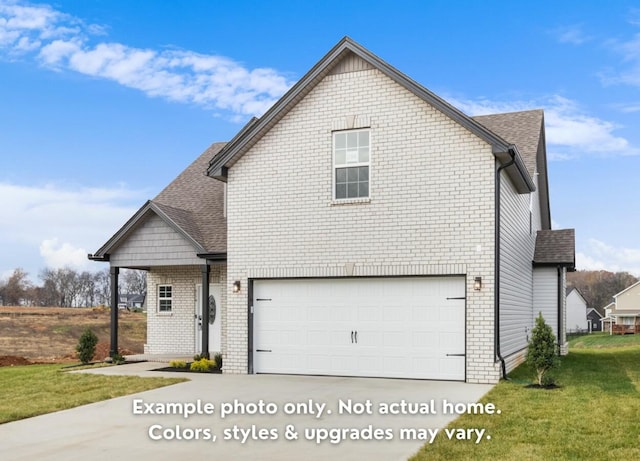 view of front property with a garage and a front lawn