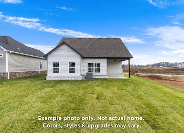 rear view of property featuring a yard, a patio, and central air condition unit