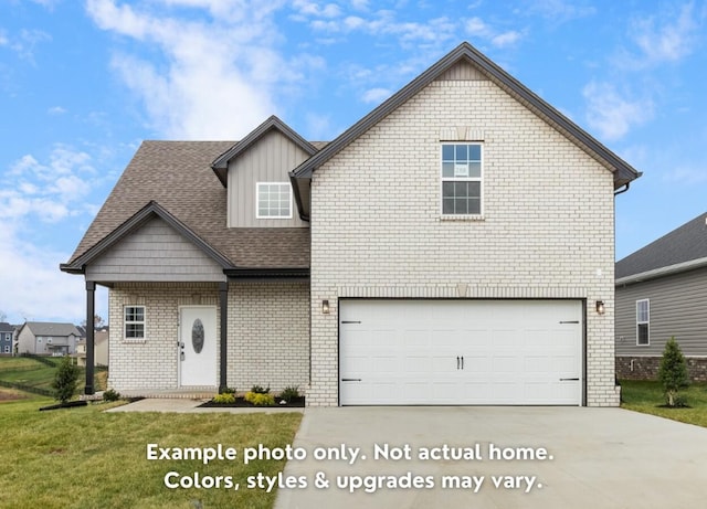 view of front of property with a garage and a front yard