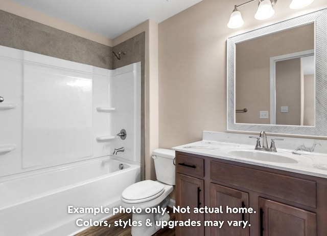 full bathroom featuring bathing tub / shower combination, vanity, and toilet