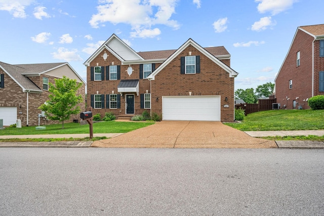 view of front of property featuring a garage, central air condition unit, and a front lawn