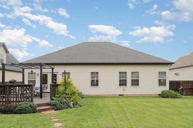 rear view of house featuring a yard, a pergola, and a wooden deck