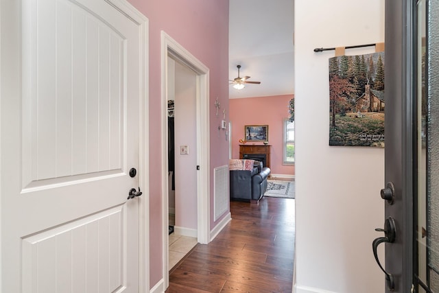 hall with dark hardwood / wood-style flooring